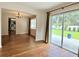 Bright dining area with wood floors, slider to outdoor patio, and easy access to the kitchen at 1921 Japonica Rd, Winter Park, FL 32792