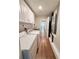 Functional laundry room with a washer, dryer and white cabinets at 1921 Japonica Rd, Winter Park, FL 32792