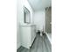 Modern bathroom with white vanity, updated fixtures, and gray flooring, creating a clean and stylish space at 2221 Wakulla Way, Orlando, FL 32839