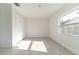 A minimalist bedroom with lots of light, tile floors, and a closet at 2221 Wakulla Way, Orlando, FL 32839