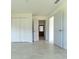 Spacious living room featuring tile floors and white doors at 2221 Wakulla Way, Orlando, FL 32839
