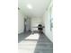 Well-lit office with gray floors, a modern desk, and an adjacent closet, ideal for a home workspace at 2221 Wakulla Way, Orlando, FL 32839
