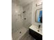 Modern bathroom featuring a marble-tiled shower with black hardware and a sleek vanity at 2549 Olive Ave, Lake Wales, FL 33898