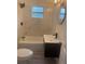 Stylish bathroom features a tub with marble tile surround and a contemporary vanity at 2549 Olive Ave, Lake Wales, FL 33898