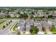 An aerial view shows the neighborhood with manicured lawns and well-maintained houses at 2740 Picasso Ct, Kissimmee, FL 34743