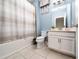 Bathroom with shower/tub combo, and a single sink vanity with a white countertop at 2740 Picasso Ct, Kissimmee, FL 34743