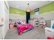 Colorful ' bedroom featuring playful decor and a cozy atmosphere at 2740 Picasso Ct, Kissimmee, FL 34743