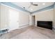 Cozy bedroom featuring plush carpeting, a ceiling fan, and neutral paint tones at 2740 Picasso Ct, Kissimmee, FL 34743