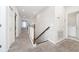 Hallway boasts paneled accent wall and carpet flooring and is adjoined by a utility closet and views into other rooms at 2740 Picasso Ct, Kissimmee, FL 34743