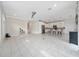 A spacious living room with tile floors and access to the kitchen area at 2740 Picasso Ct, Kissimmee, FL 34743