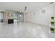 Spacious living room with tile floors, ceiling fan and sliding glass doors to the backyard at 2740 Picasso Ct, Kissimmee, FL 34743