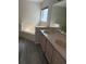 Bright bathroom with double sinks and combination shower and tub at 2833 Falling Tree Cir, Orlando, FL 32837
