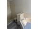 Spacious bathroom featuring a tiled shower and a separate soaking tub at 2833 Falling Tree Cir, Orlando, FL 32837