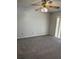 Spacious bedroom with neutral carpet, ceiling fan, and bright natural light at 2833 Falling Tree Cir, Orlando, FL 32837