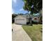 Charming two-story home featuring a well-manicured lawn and attached two-car garage at 2833 Falling Tree Cir, Orlando, FL 32837