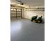 Spacious garage with room for parking, mower and storage, perfect for a workshop at 2833 Falling Tree Cir, Orlando, FL 32837
