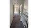 Hallway with view to sliding doors and staircase to the main level at 2833 Falling Tree Cir, Orlando, FL 32837