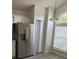 Bright kitchen featuring stainless steel refrigerator and breakfast nook near windows at 2833 Falling Tree Cir, Orlando, FL 32837