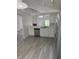 Spacious kitchen with wood-look floors and stainless steel dishwasher at 2833 Falling Tree Cir, Orlando, FL 32837