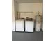Functional laundry room with white washer, dryer, and Ao Smith water heater at 2833 Falling Tree Cir, Orlando, FL 32837
