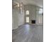 Living room featuring a fireplace, high ceilings, and an open, airy ambiance at 2833 Falling Tree Cir, Orlando, FL 32837