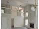 Spacious living room with high ceilings, fireplace, and wood-look flooring at 2833 Falling Tree Cir, Orlando, FL 32837