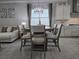 Dining area featuring a large window for lots of natural light and access to the kitchen at 2853 Willowseed Ln, St Cloud, FL 34772