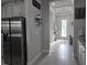 Welcoming entryway featuring tile floors, neutral décor, and seamless access to the modern kitchen at 2853 Willowseed Ln, St Cloud, FL 34772