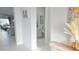 Inviting entryway featuring neutral tones, tile flooring, and an adjacent powder room for added convenience at 2853 Willowseed Ln, St Cloud, FL 34772