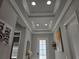 The foyer features a tray ceiling, recessed lighting, and neutral-colored walls at 2853 Willowseed Ln, St Cloud, FL 34772