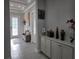Foyer featuring built-in cabinets and view of the front entrance and hallway at 2853 Willowseed Ln, St Cloud, FL 34772