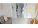 Welcoming foyer with neutral walls, tile flooring, and view of the hallway at 2853 Willowseed Ln, St Cloud, FL 34772