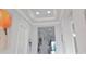 Elegant foyer with tray ceiling, recessed lighting, and neutral wall color at 2853 Willowseed Ln, St Cloud, FL 34772