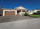 Inviting single-story home with a stone-accented facade, well-manicured landscaping, and a paved driveway at 2853 Willowseed Ln, St Cloud, FL 34772