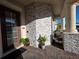 Charming front porch with stone accents, brick pavers, and a welcoming entrance door at 2853 Willowseed Ln, St Cloud, FL 34772