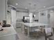 Spacious kitchen with large island, pendant lighting and stainless-steel refrigerator at 2853 Willowseed Ln, St Cloud, FL 34772