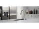 Modern kitchen featuring stainless steel appliances, faucet and a bright countertop at 2853 Willowseed Ln, St Cloud, FL 34772