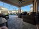 Covered patio featuring comfortable seating, a ceiling fan, and a view of the backyard at 2853 Willowseed Ln, St Cloud, FL 34772