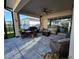 Covered patio featuring comfortable seating, a ceiling fan, and a view of the backyard at 2853 Willowseed Ln, St Cloud, FL 34772
