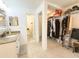 Bathroom featuring a granite vanity, closet, and ensuite toilet at 3006 S Semoran Blvd # H-3, Orlando, FL 32822