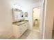 Bathroom featuring a granite vanity, and ensuite shower at 3006 S Semoran Blvd # H-3, Orlando, FL 32822