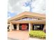 Clubhouse entrance with modern architecture and well-maintained landscaping at 3006 S Semoran Blvd # H-3, Orlando, FL 32822