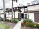 Charming townhome featuring well-maintained landscaping, and a welcoming entryway at 3006 S Semoran Blvd # H-3, Orlando, FL 32822