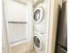 Efficient laundry area with stacked washer and dryer, tucked neatly off the kitchen at 3006 S Semoran Blvd # H-3, Orlando, FL 32822