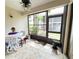 Bright sunroom features tile floors, screened windows, and plenty of natural light at 3006 S Semoran Blvd # H-3, Orlando, FL 32822
