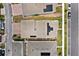 Aerial view showcasing neighborhood roofs, solar panels, landscaping, and street layout at 3026 Prospect Trl, St Cloud, FL 34771