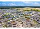 Aerial view of a large residential community with diverse home styles, landscaping, and neighborhood streets at 3026 Prospect Trl, St Cloud, FL 34771