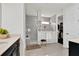 Luxurious bathroom with a walk-in shower, elegant vanity, and access to a walk-in closet at 3026 Prospect Trl, St Cloud, FL 34771