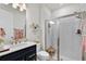 Modern bathroom featuring a walk-in shower, sleek vanity and stylish fixtures at 3026 Prospect Trl, St Cloud, FL 34771