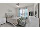 Comfortable bedroom featuring plush bedding, accent pillows and natural light at 3026 Prospect Trl, St Cloud, FL 34771